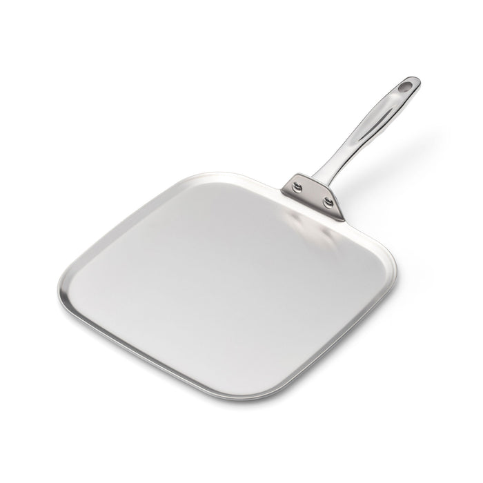Angled view of 11 Inch Square Griddle showcasing its stainless steel surface and ergonomic long handle with a white background
