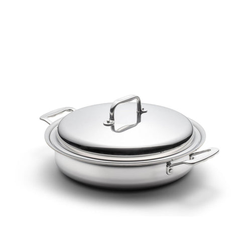 Front three-quarter view of a 3.5-quart stainless steel sauté pan with lid and short handles on a white background