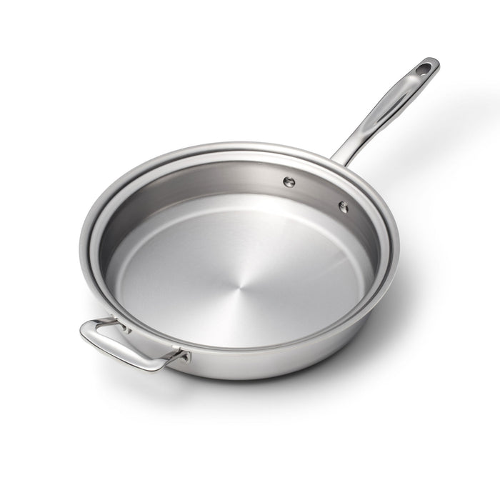 Angled top view of 7-inch sauté skillet showing stainless-steel interior, long riveted handle and loop helper handle on white background