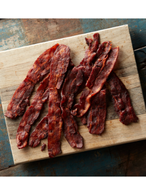 Bacon Jerky on a wood cutting board