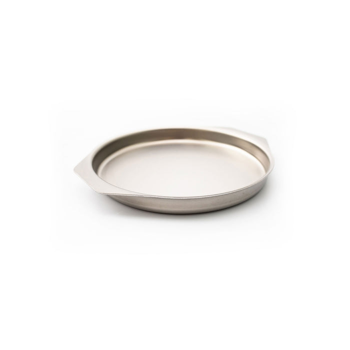 Angled view of 9 inch Round Brownie Pan showcasing its raised rim and side handles against a white background