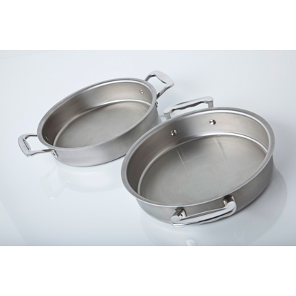 Three-quarter top view of a 9-inch round stainless steel cake pan with side handles showing brushed interior and rivets on a light reflective surface