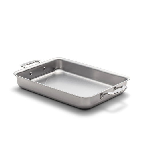 Angled view of 9 inch by 13 inch Bake and Roast Pan with Handles showcasing stainless steel on a white background