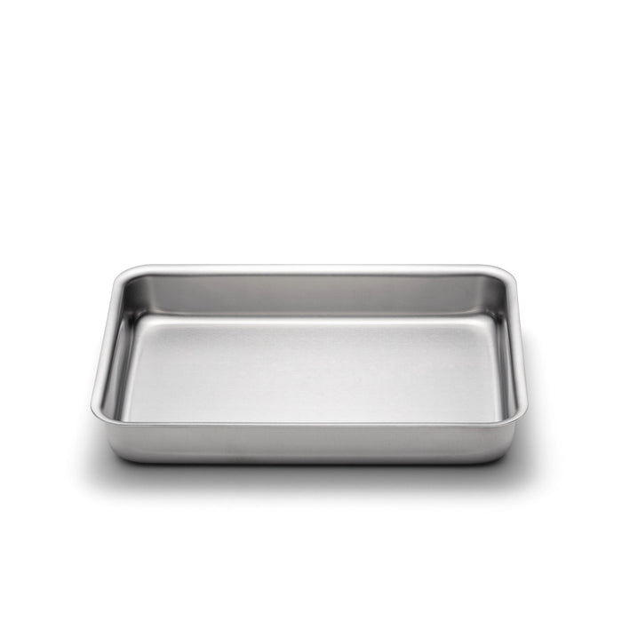 Angled top view of 9 x 13 Bake & Roast Pan with no handles showcasing stainless steel interior and rolled edges on white background