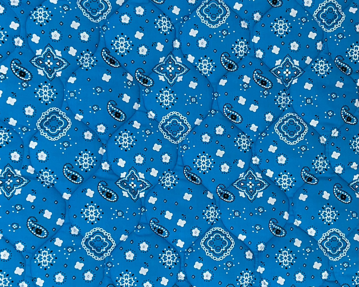 Turquoise cotton crate dog bed with a bandana pattern, soft and comfortable for small to medium-sized dogs.