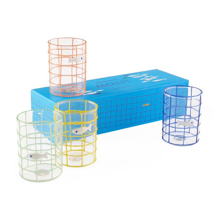 Set of four glass tumblers with fish designs and metal cages on a white background