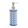 A cylindrical soap dispenser with a blue and white geometric patterned body, a light blue top, and a polished silver pump dispenser.