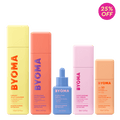 Collection of BYOMA skincare products with colorful packaging on a green background