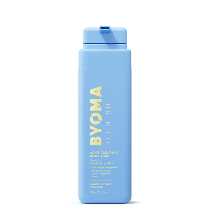 A light blue plastic bottle of BYOMA BLEMISH Acne Clearing Body Wash, featuring yellow text and a matching blue flip-top cap, centered on a plain white background.