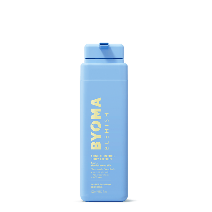A light blue plastic bottle of BYOMA BLEMISH Acne Control Body Lotion with yellow text, centered on a white background.