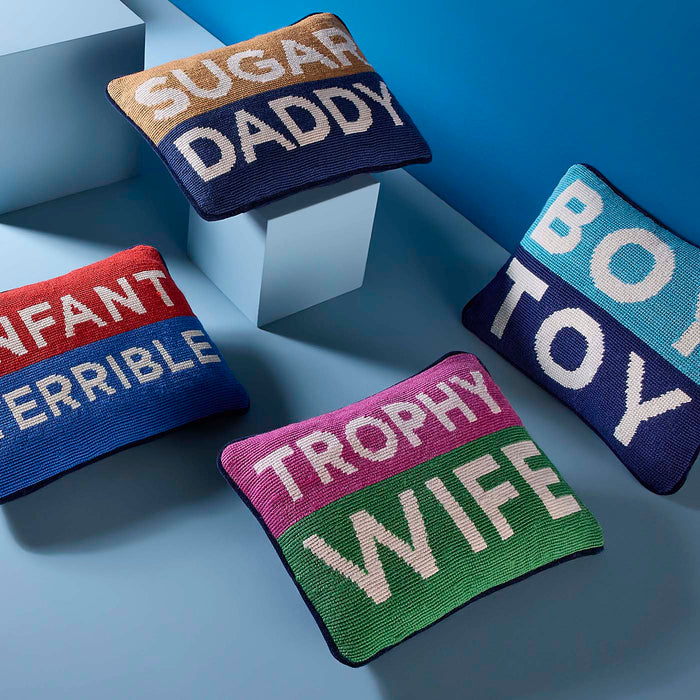 Four colorful pillows with text on a blue background