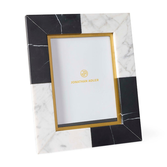 Marble-patterned photo frame with gold border on a white background