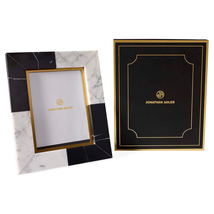 Two photo frames with black, white, and gold design, featuring the Jonathan Adler logo.
