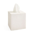 A white square tissue box cover with a tissue protruding from the top, featuring vertical fluted sides and a honeycomb-like embossed pattern on the front, shown on a plain white background.