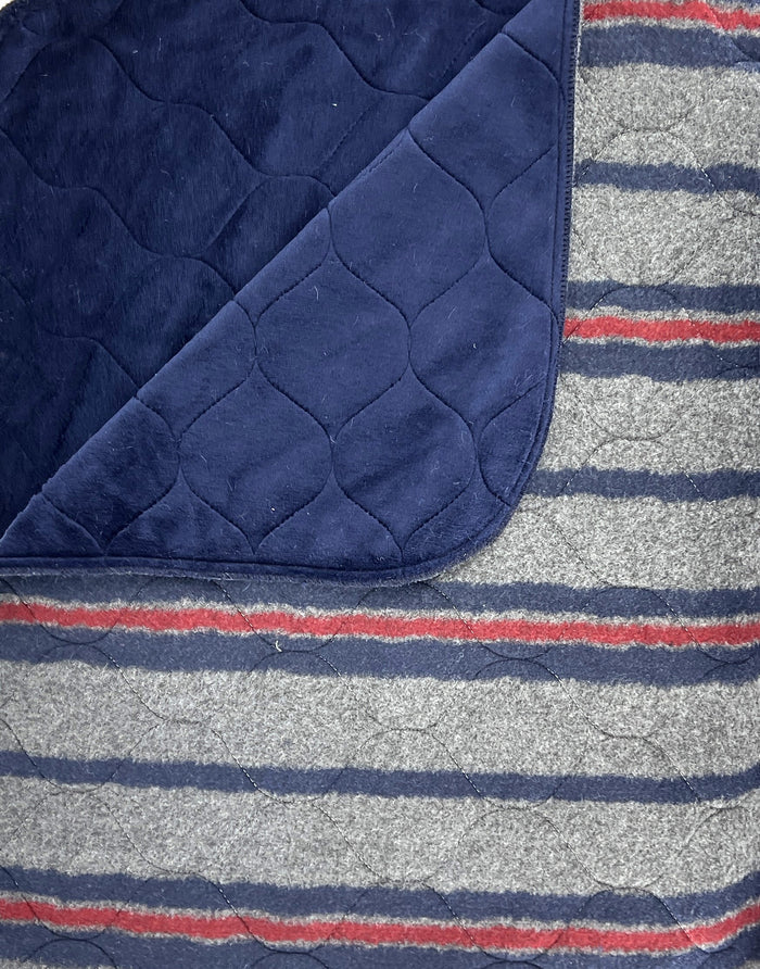 Blue wool-striped dog bed from Fms Dog Beds with a cozy, soft design for pet comfort.