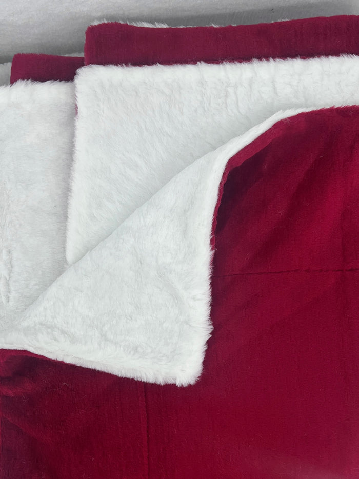 Fms Dog Beds burgundy and white blanket draped over a cozy dog bed for comfort and warmth.
