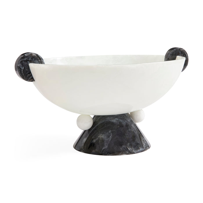 A modern sculptural bowl with a smooth matte white interior and a dark marbled black exterior, featuring spherical side handles and a pedestal base on a white background.