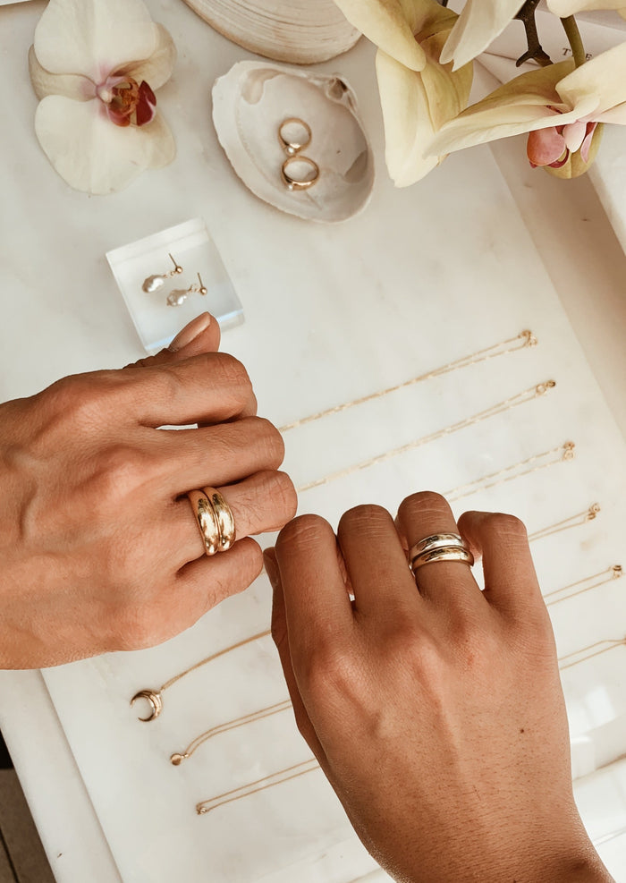 alt="double dare to love dome ring gold and gold and gold and silver"