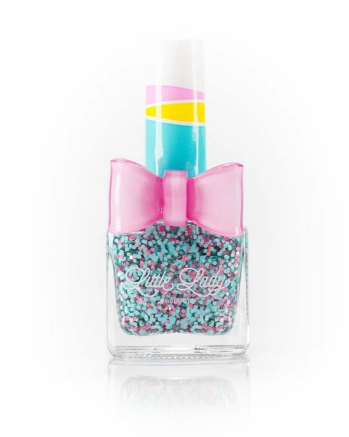 Dino S’mores nail polish bottle with pink and blue glitter, offering a marshmallow scent, designed for kids' fun and safe manicures.
