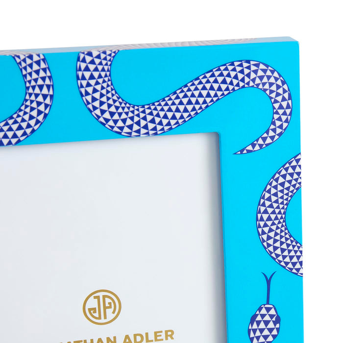 Blue decorative box with geometric pattern and Jothan Adler logo