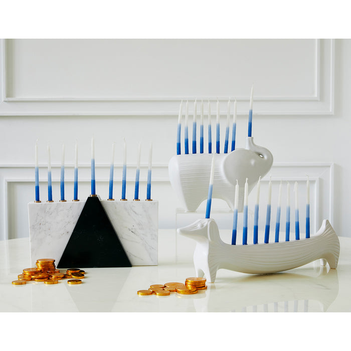 ceramic elephant and dachshund menorahs with candles - styled view 2