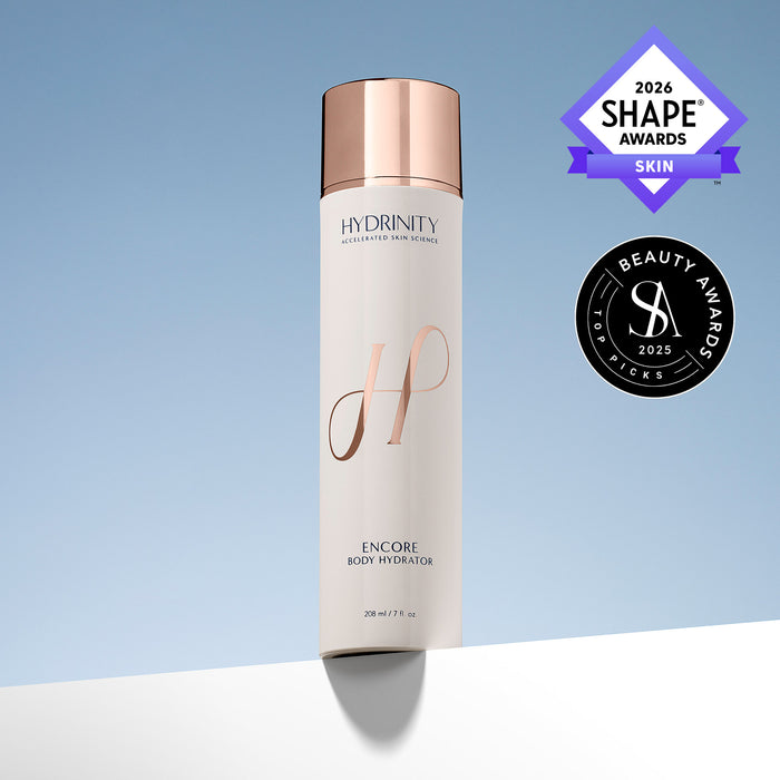 Hydrinity Encore Body Hydration bottle with a metallic rose gold cap and white body, shown on a light blue gradient background with Shape Awards 2026 and Beauty Awards 2025 badges.