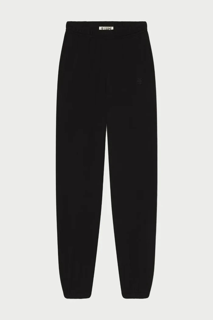 The Éterne Boyfriend Pocket Sweatpant by Eterne, in black French terry with an elastic waistband and cuffs, is displayed flat on a white background—an elevated loungewear essential featuring the relaxed fit of a classic boyfriend sweatpant.
