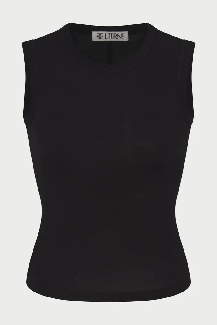 The Éterne Fitted Muscle Tank by Eterne is a sleeveless, fitted black top featuring a crew neckline. Made from a smooth and stretchy cotton-modal blend, this muscle tank offers a snug, comfortable fit and includes the brand’s signature “ETERNE” label inside the collar.