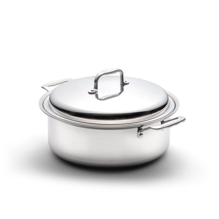Angled front view of Factory Seconds 6-quart stainless steel stockpot with cover showcasing loop handles on white background