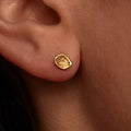 unique flat gold stud earring with an organic circle shape and textured surface