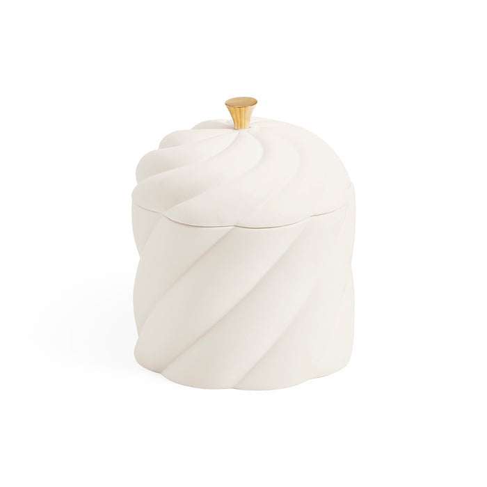 A white ceramic lidded container with a sculpted, twisted spiral design and a small gold-toned knob on top, set against a plain white background.