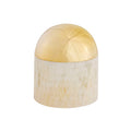 Decorative object with gold top and beige base on a white background