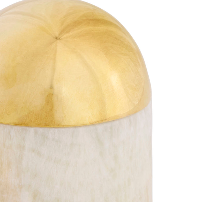 Decorative item with gold top and white base on a white background
