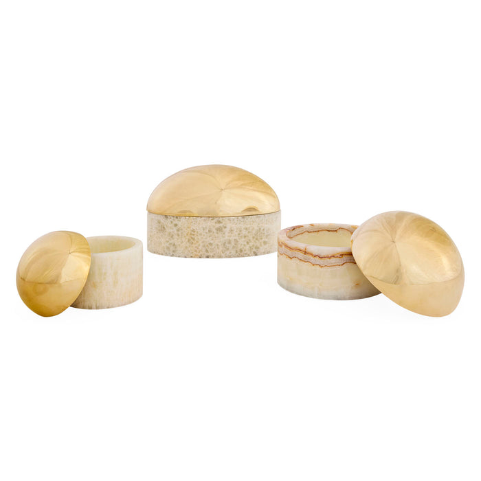 Set of four onyx jewelry boxes with gold accents on a white background