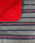 Red wool-striped dog bed by Fms Dog Beds, cozy and plush, perfect for canine comfort and warmth.