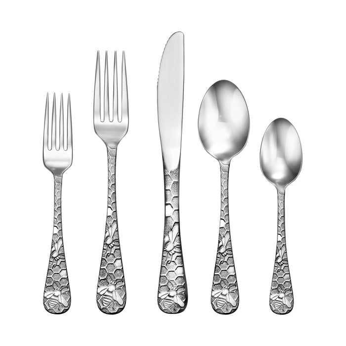 Front view of five-piece Honey Bee flatware showcasing honeycomb bee-patterned handles on white background