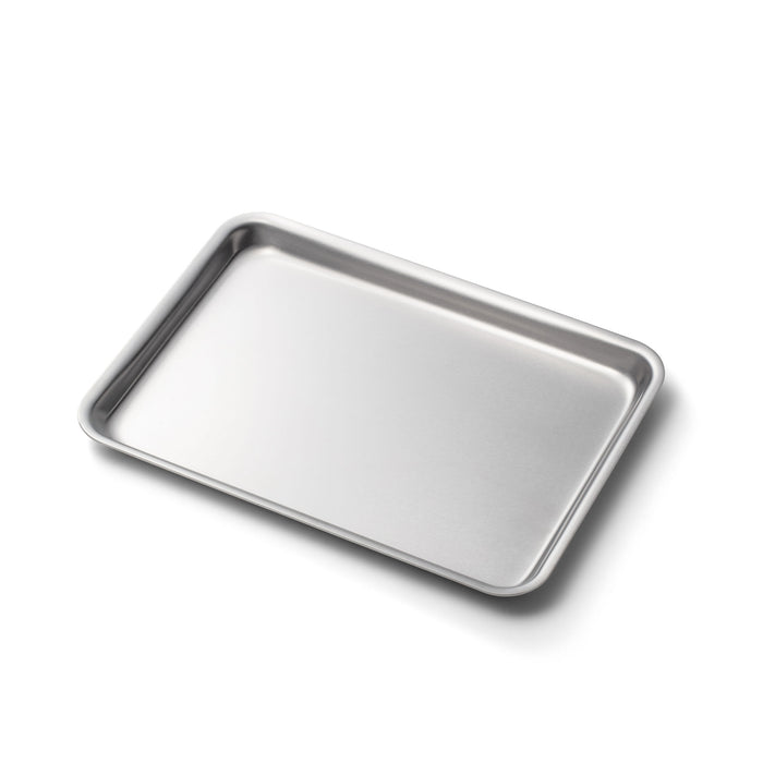 Angled view of 360 Stainless Steel Jelly Roll Pan showcasing nearly 1 inch raised lip on white background