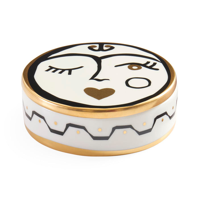 Decorative ceramic pot with face design on a white background
