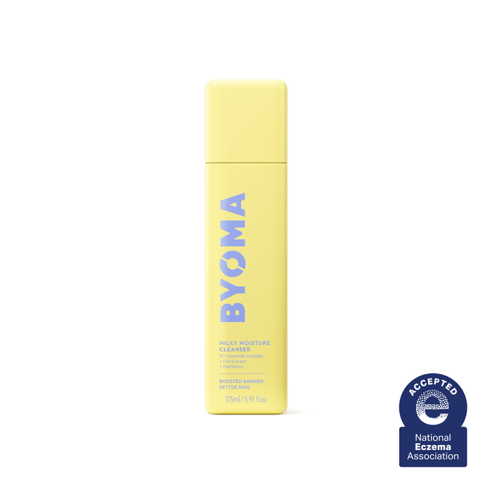 A yellow bottle of Byoma Milky Moisture Cleanser with the National Eczema Association seal.