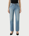 A person wearing Moussy Leyden Straight Jeans by Moussy and black heels, shown from waist to feet, stands against a white backdrop.