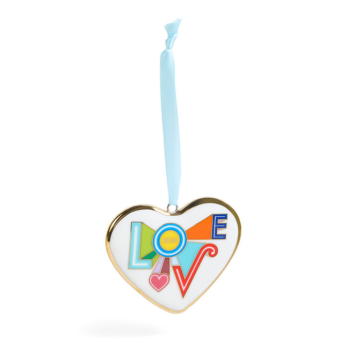 A heart-shaped hanging ornament with a gold-toned border, a white center, and the word LOVE spelled out in colorful geometric shapes. A light blue ribbon is tied to the top for hanging.