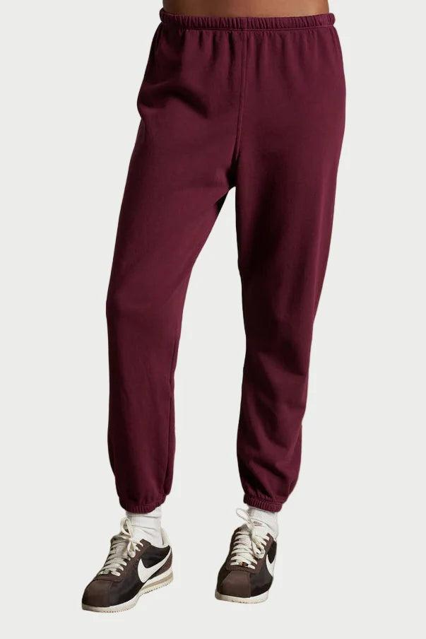 A person wearing the Perfectwhitetee Johnny Sweatpant in Burgundy by perfectwhitetee.