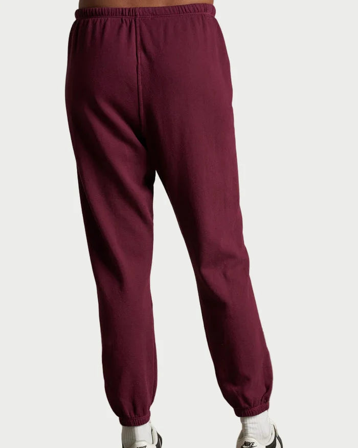 A person shown from the back wears Perfectwhitetee Johnny Sweatpant in Burgundy with white Nike socks and sneakers, standing against a plain white background.