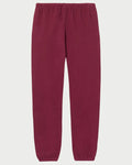 The Perfectwhitetee Johnny Sweatpant in burgundy by perfectwhitetee is made from soft French terry cotton and features an elastic waistband and ankle cuffs, shown against a plain white background.