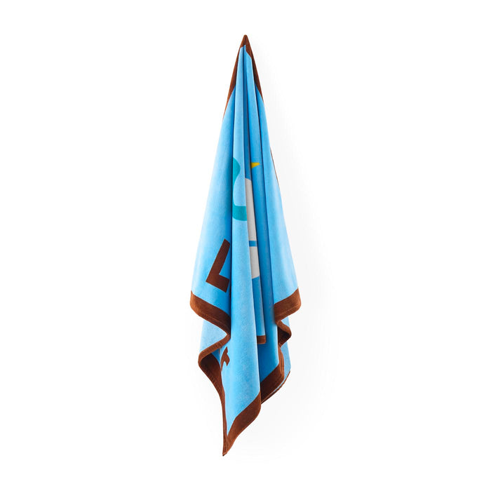 Light blue towel with brown border on a white background