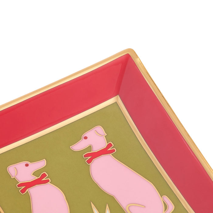 Close-up of a square decorative tray with a gold rim, a pink interior border, and a green center featuring two pink dogs wearing red collars.