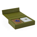 Green leather card holder with two cards inside on a white background