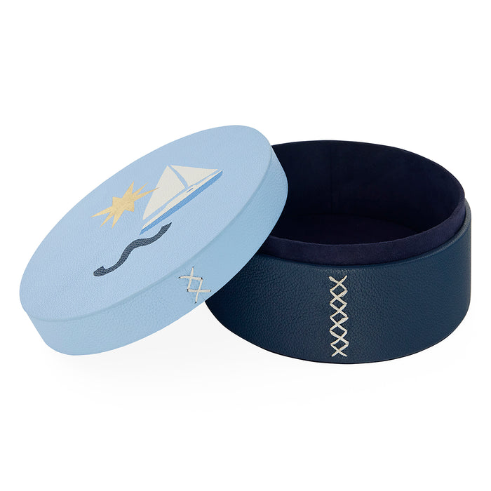 Navy blue jewelry box with a light blue lid featuring a paper airplane design on a white background