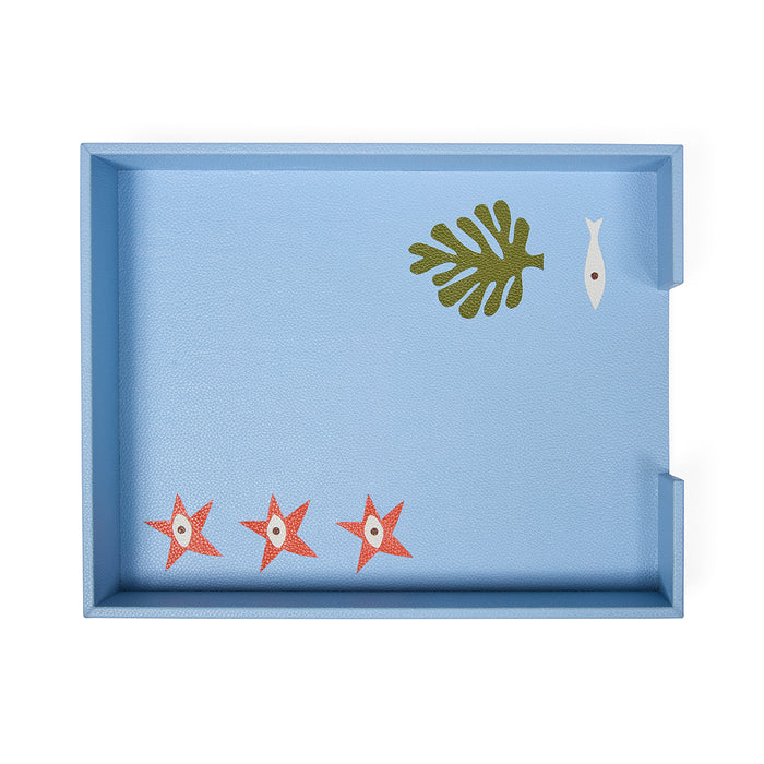 Decorative tray with starfish, leaf, and fish designs on a light blue background