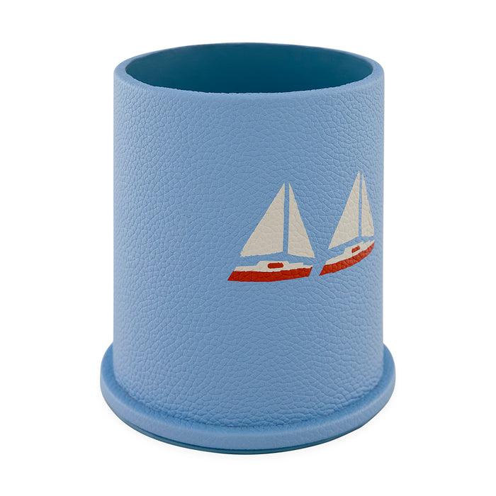 Blue textured cup with sailboat design on a white background